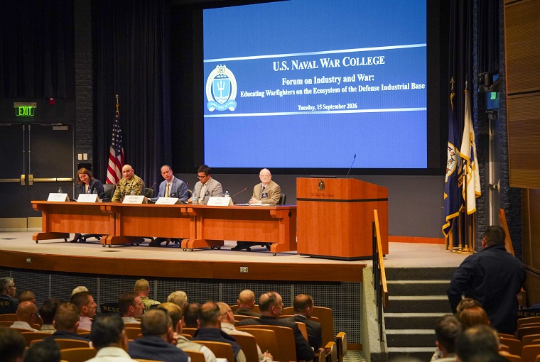 Several people sitting for a panel